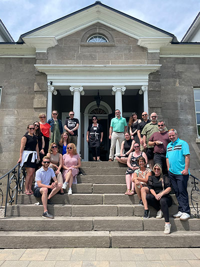 Hands-On Group Lunch + Meeting Package - Corporate - Bunch of people standing on stone stairs at Maison Maitland